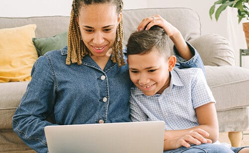 Mom and son looking something in the computer