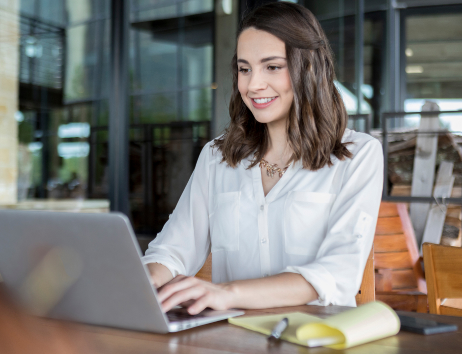 Business student working at her desk with her laptop